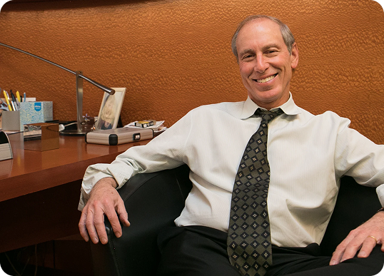 Dr. Jeffrey Shapiro seated in his office