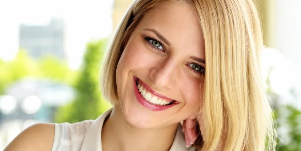 Patient smiling after cosmetic dental care
