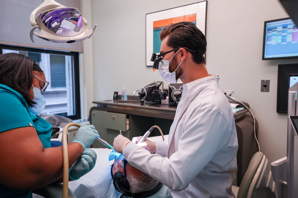 Dental team caring for a patient