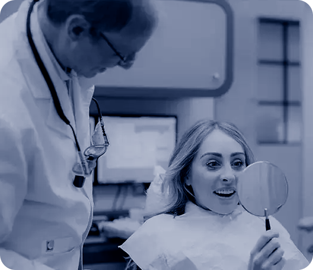 Dentist showing a patient the results of her treatment