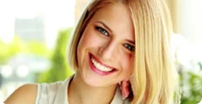 Patient smiling after cosmetic dental care